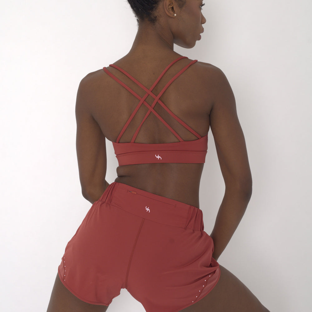 POWERFLOW LIGHT SUPPORT STRAPPY SPORTS BRA BURNT ORANGE